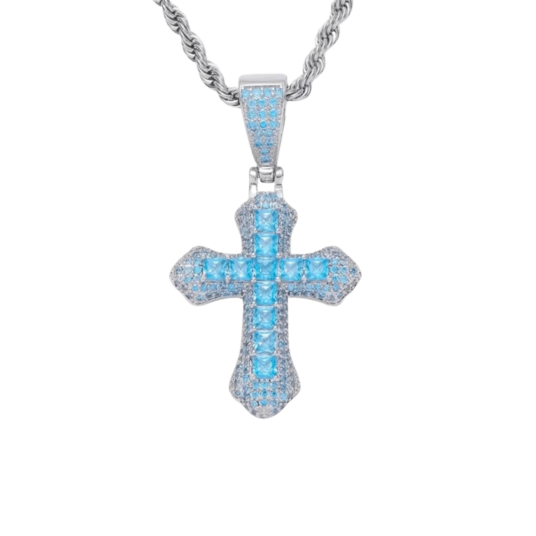 White gold cross pendant featuring vibrant blue gemstones at the center, set with a sleek and polished finish.