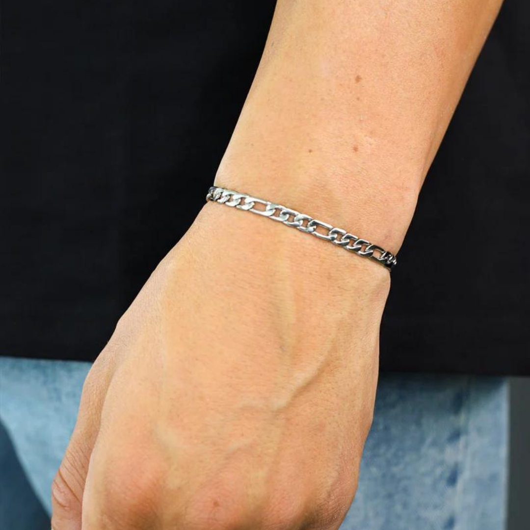 Men's model showcasing the Figaro Bracelet in 925 Sterling Silver with a White Gold finish, emphasizing a sophisticated and high-end accessory.