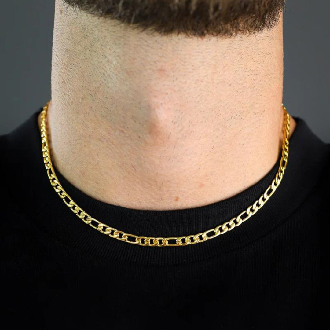 Men's model wearing the Figaro Chain in 18K Gold, showcasing a striking and sophisticated accessory with a bold 5MM link design.