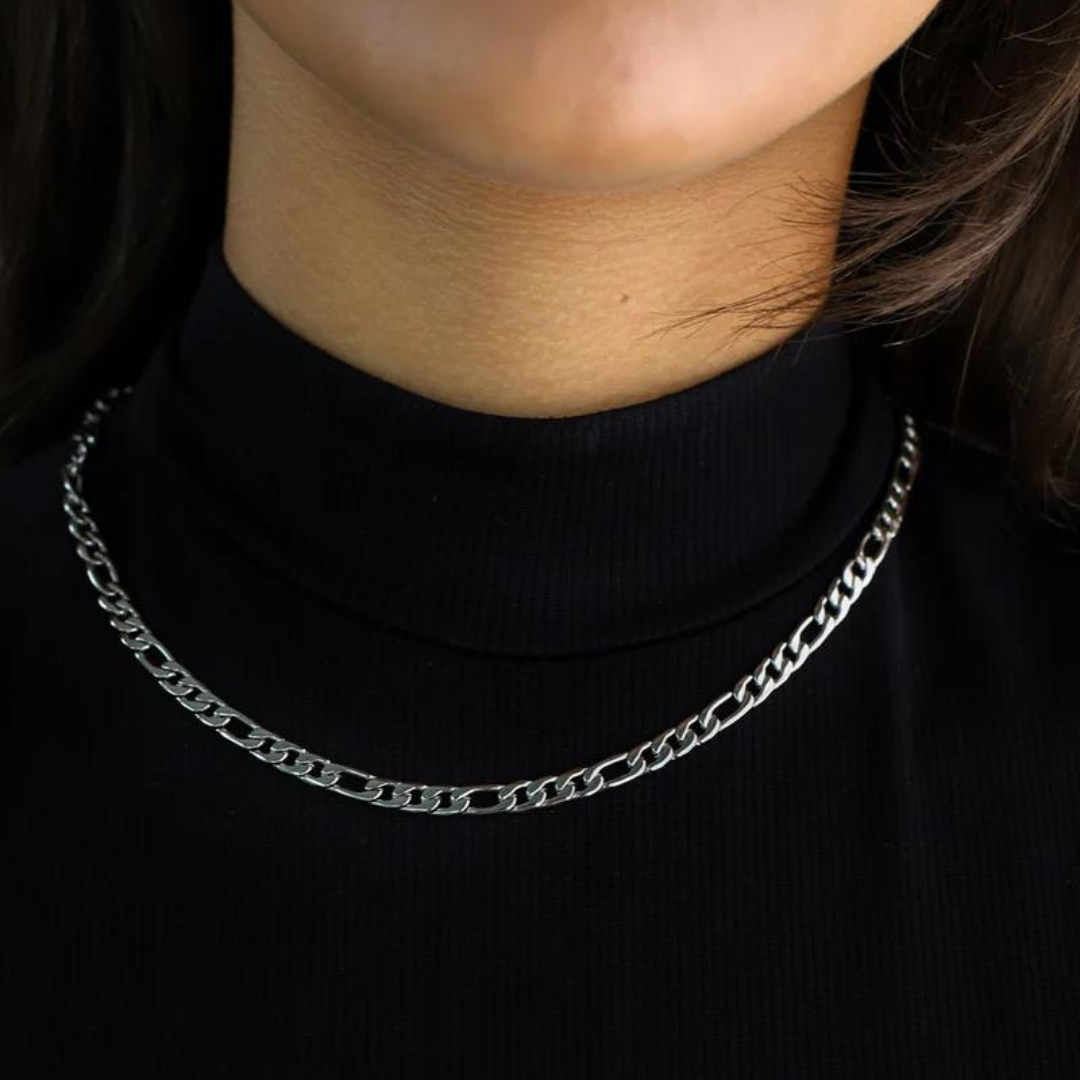 Women's model wearing the Figaro Chain in White Gold, highlighting a chic and polished piece with sleek 5MM links.