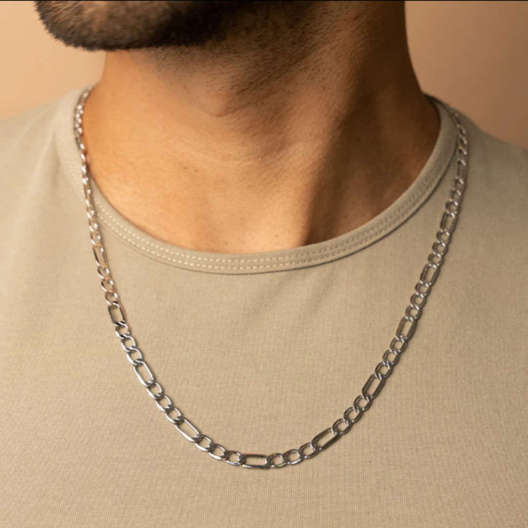 Men's model showcasing the Figaro Chain in White Gold, featuring striking 7MM links for a refined and luxurious accessory.