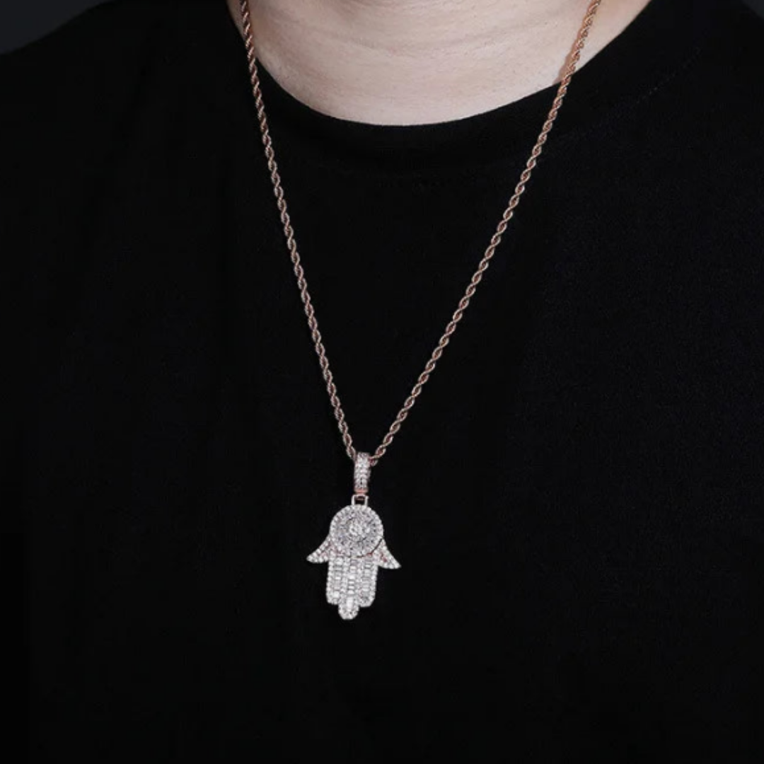 Men's model showcasing the Hamsa Pendant in 925 Sterling Silver with a White Gold finish, featuring intricate detailing and a refined design that adds a stylish and protective touch.