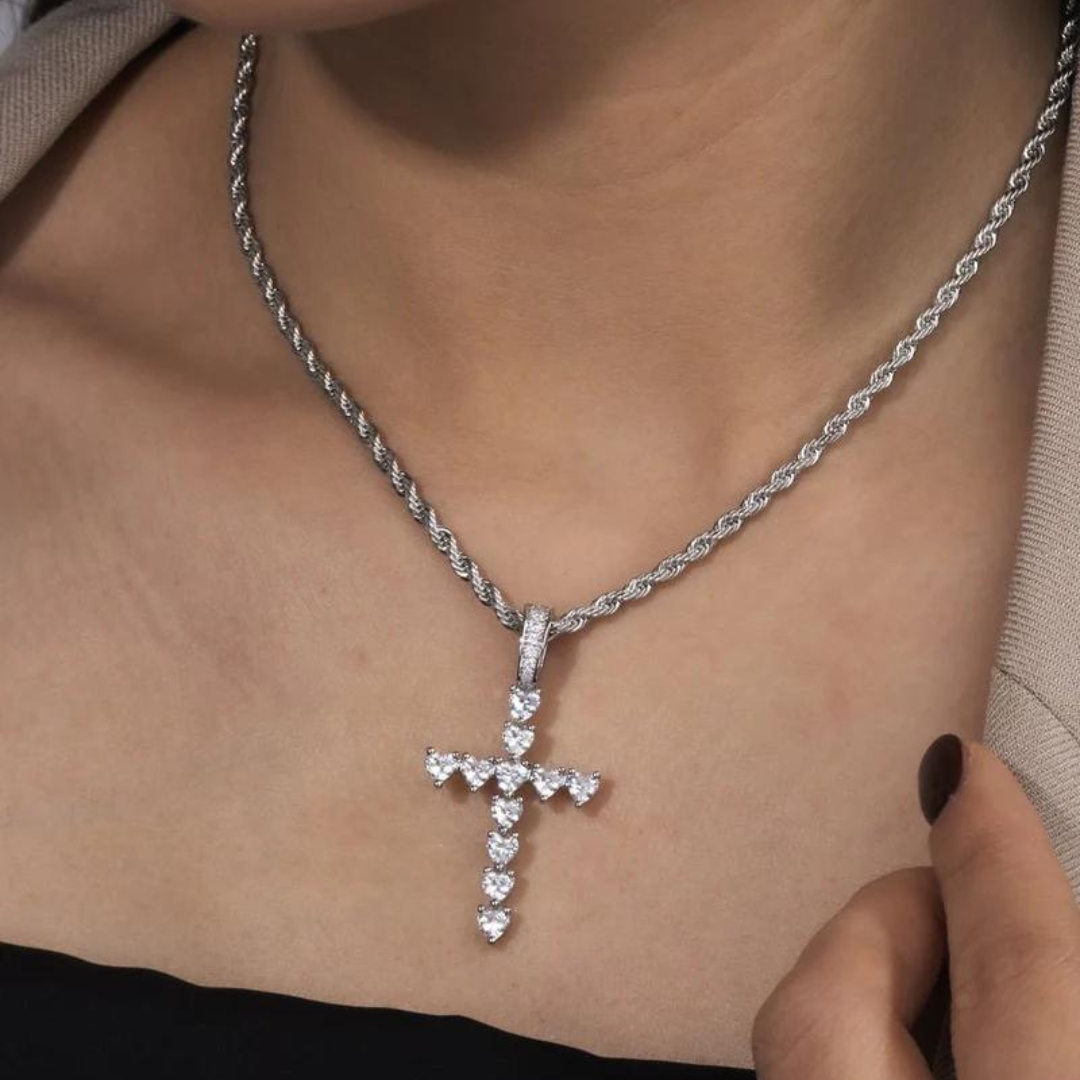 Women's model wearing the Heart Cross Pendant in White Gold, highlighting a chic and elegant piece with a meaningful heart and cross design for a luxurious look.