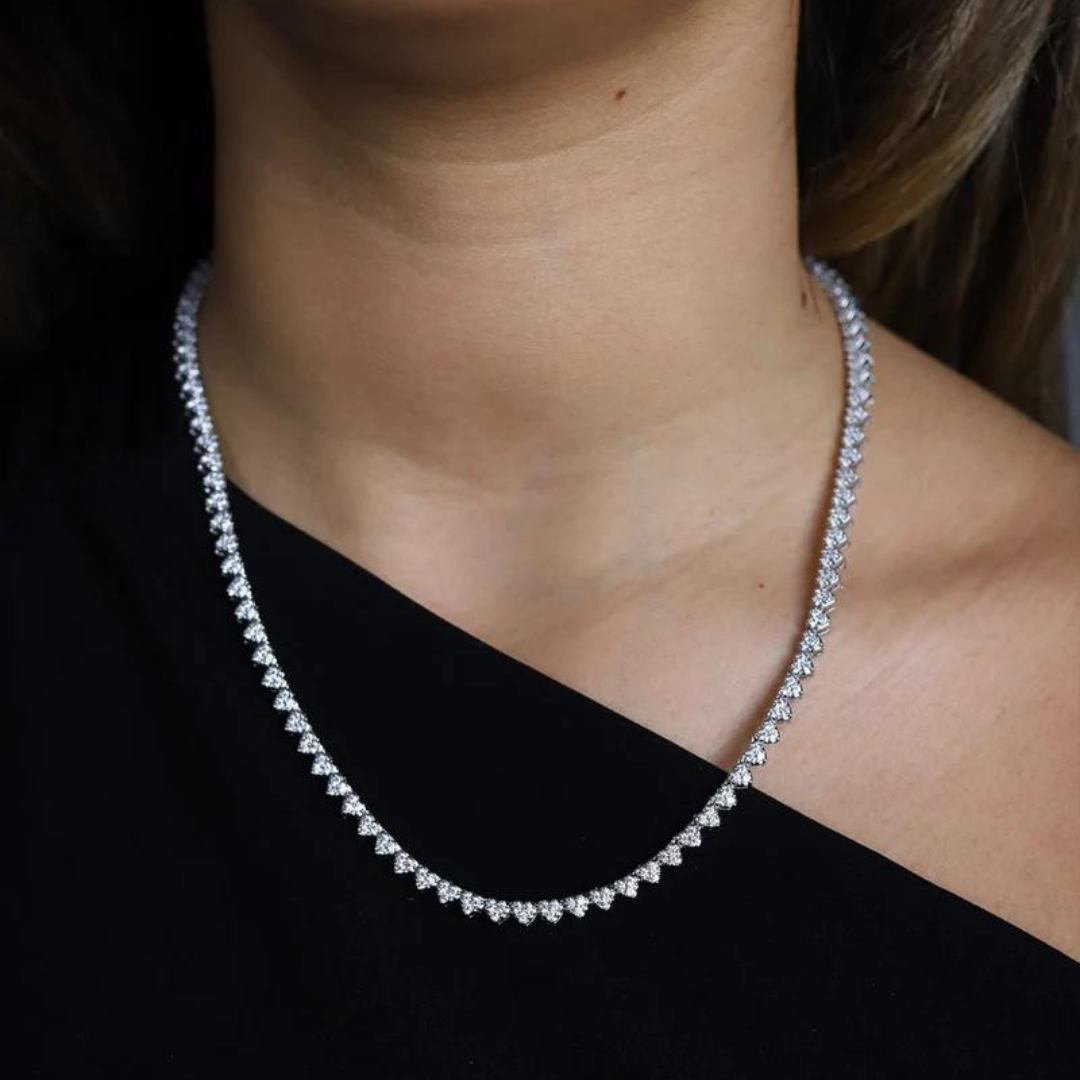 Women's model wearing the Heart Tennis Chain in White Gold, highlighting a chic and elegant piece with 4MM links and heart-shaped accents for a luxurious look.