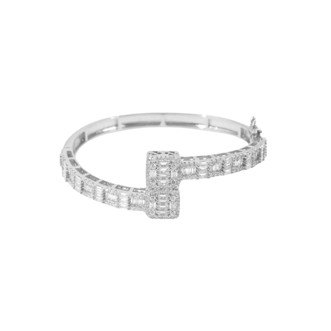 Elegant Iced Bangle Bracelet crafted in White Gold, featuring intricate detailing and dazzling gemstone embellishments for a luxurious and eye-catching design.