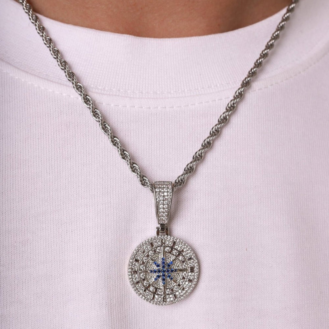 Men's model showcasing the Iced Compass Pendant in White Gold, featuring a detailed compass design with dazzling gemstones for a bold and sophisticated accessory.