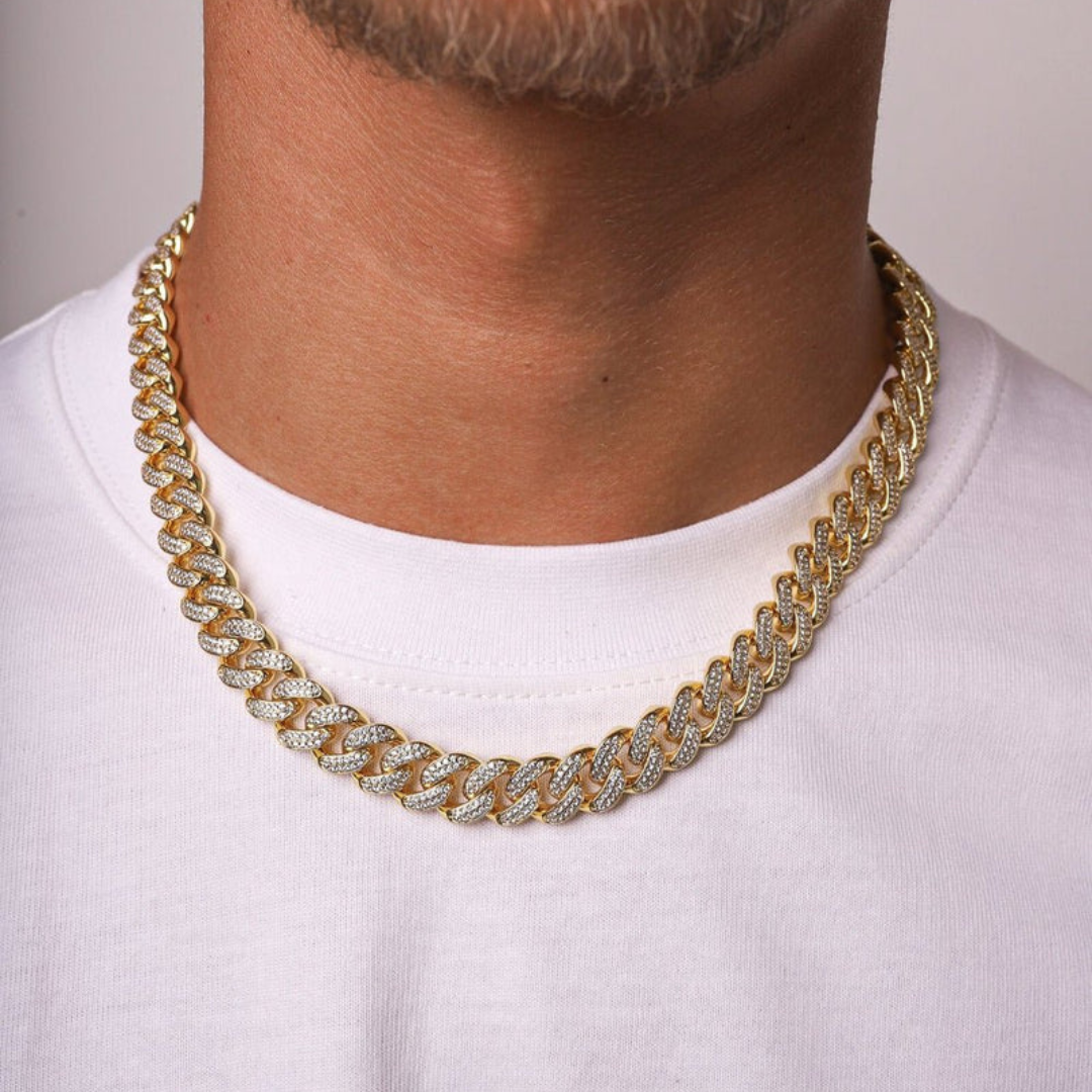 Men's model showcasing the Iced Cuban Link Chain in 18K Gold with 10MM links, featuring a powerful design with dazzling gemstones for a sophisticated and high-impact accessory.