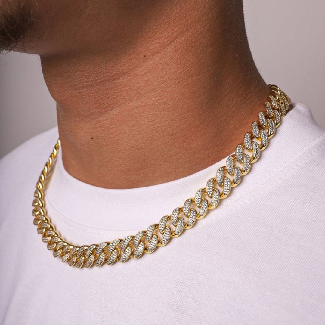 Men's model displaying the Iced Cuban Link Chain in 18K Gold with 10MM links from a different angle, emphasizing the bold design and dazzling gemstones for a sophisticated and striking accessory.