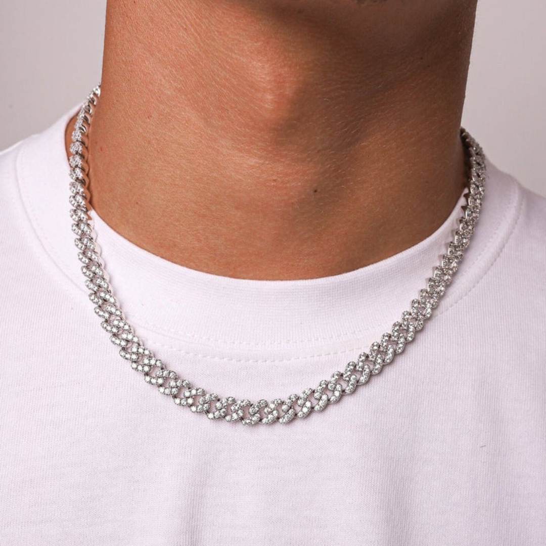 Men's model showcasing the Iced Cuban Link Chain in White Gold with 8MM links, featuring a stylish design with dazzling gemstones for a sophisticated and impactful accessory.