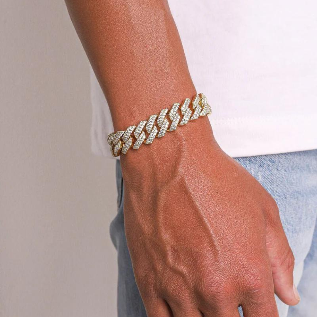 Men's model showcasing the Iced Prong Bracelet in 18K Gold with 13MM links, featuring a bold design with prong-set sparkling gemstones for a refined and powerful accessory.