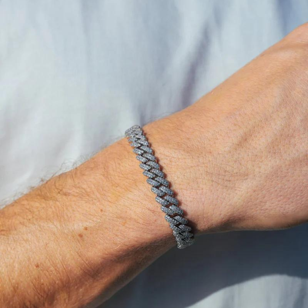 Men's model showcasing the Iced Prong Bracelet in White Gold with 9MM links, featuring a refined design with prong-set sparkling gemstones for a high-impact and sophisticated accessory.