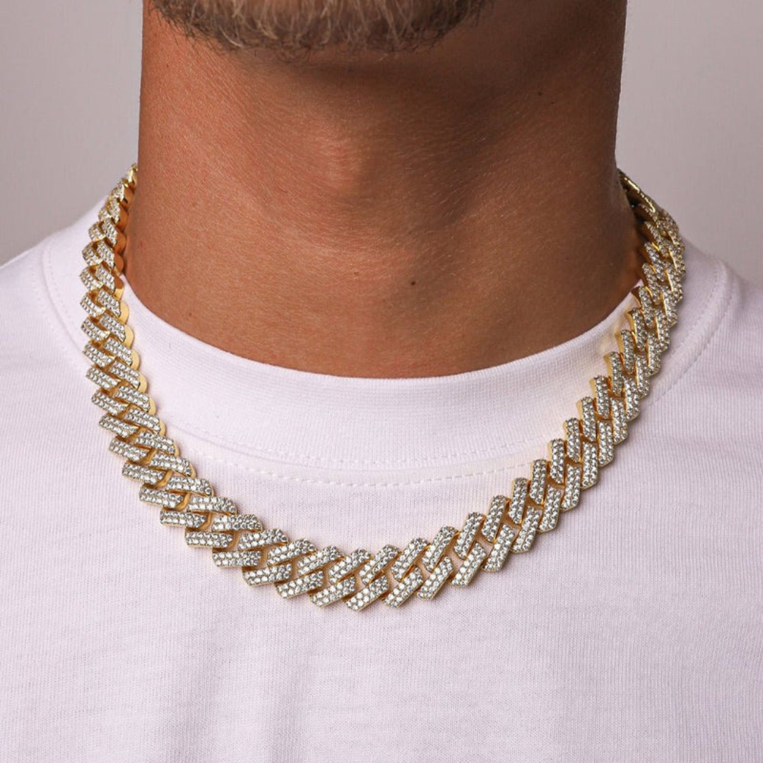 Men's model showcasing the Iced Prong Chain in 18K Gold with 13MM links, featuring a striking design with prong-set sparkling gemstones for a high-impact and luxurious accessory.