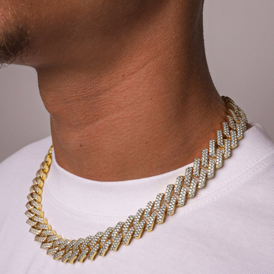 Men's model displaying the Iced Prong Chain in 18K Gold with 13MM links from a different angle, emphasizing the luxurious design and prong-set gemstones for a bold and high-impact accessory.