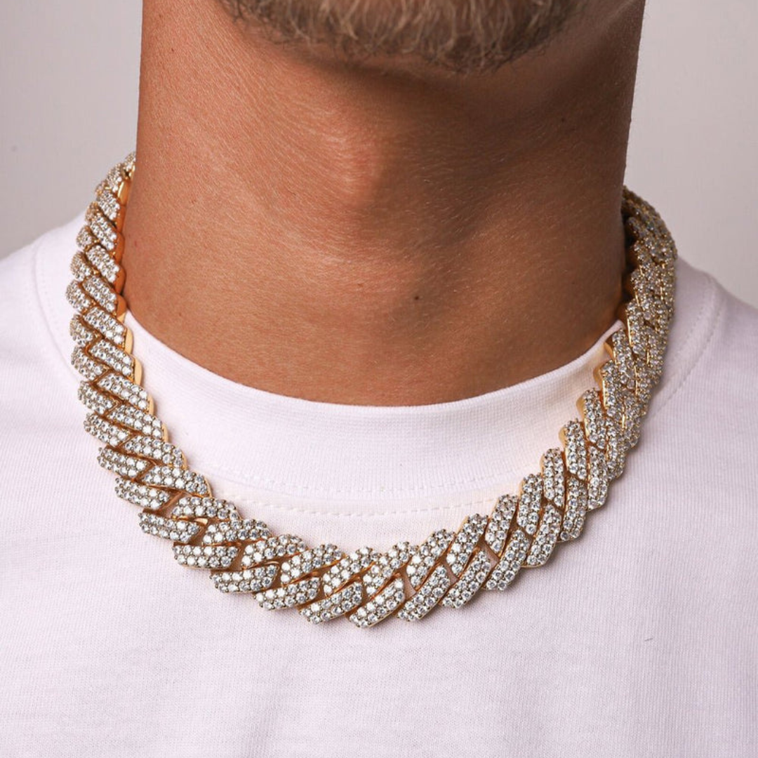 Men's model showcasing the Iced Prong Chain in 18K Gold with 18MM links, highlighting a bold and luxurious design with prong-set gemstones for a high-impact and refined accessory.