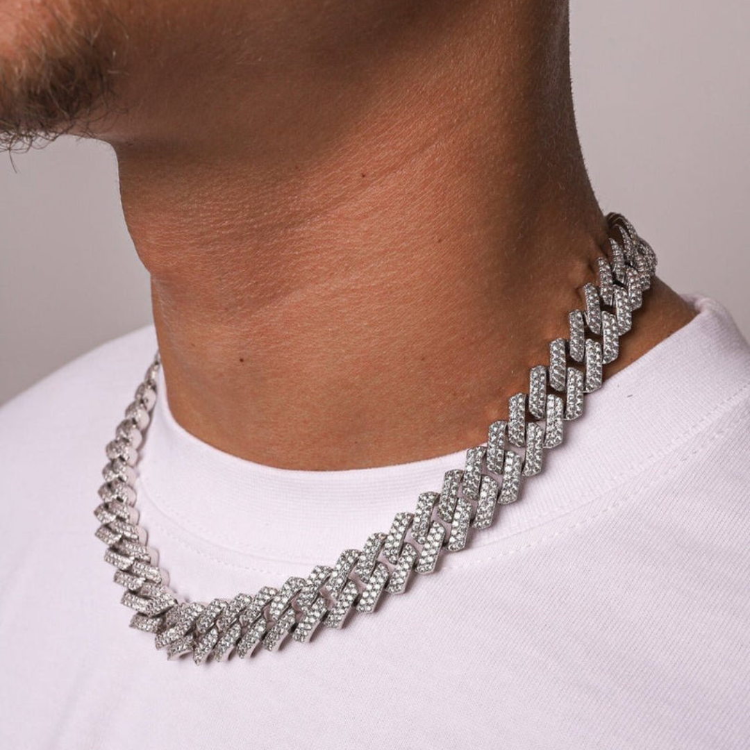 Men's model displaying the Iced Prong Chain in White Gold with 13MM links from a different angle, emphasizing the luxurious design and prong-set gemstones for a bold and high-impact accessory.