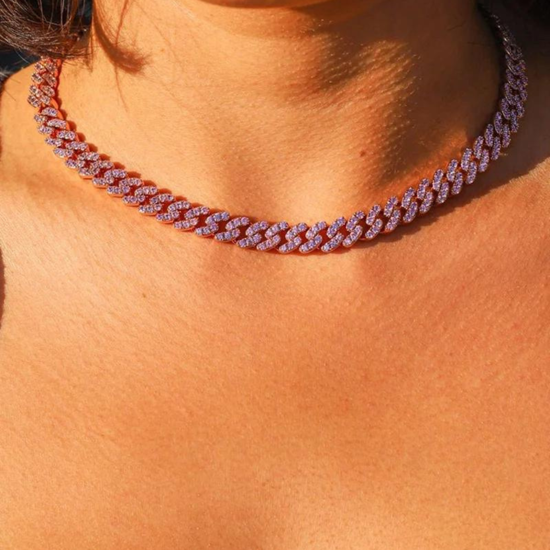 Women's model wearing the Pink Cuban Link Chain in Rose Gold with 8MM links, emphasizing its chic color and modern design for a stylish and sophisticated look.