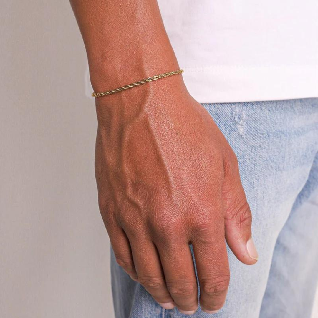 Men's model showcasing the Rope Bracelet in 18K Gold with 3MM links, highlighting its sleek design and high-quality finish for a bold and sophisticated statement.