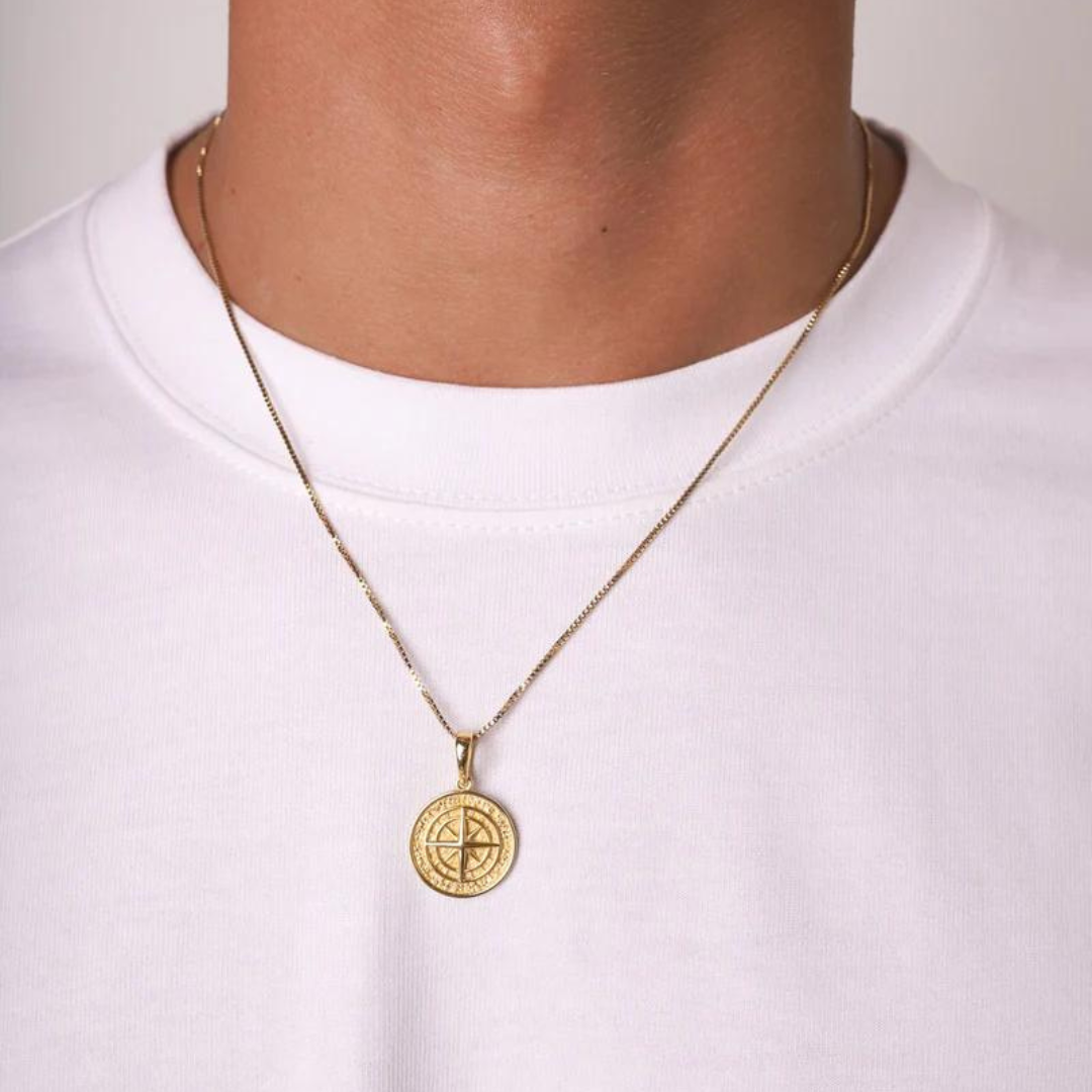 Men's model showcasing the Solid Compass Pendant in 925 Sterling Silver and 14K Gold, including a free chain, highlighting its sophisticated design and high-quality finish for a stylish and refined statement.