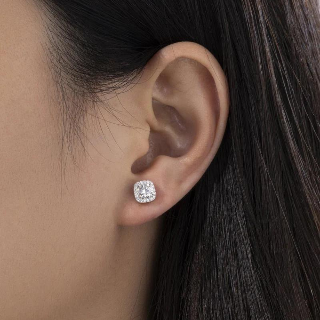 Women's model wearing the Square Crystal Studs in 925 Sterling Silver with a White Gold finish, featuring Moissanite stones. Emphasizing their elegant design and dazzling brilliance for a chic and sophisticated look.