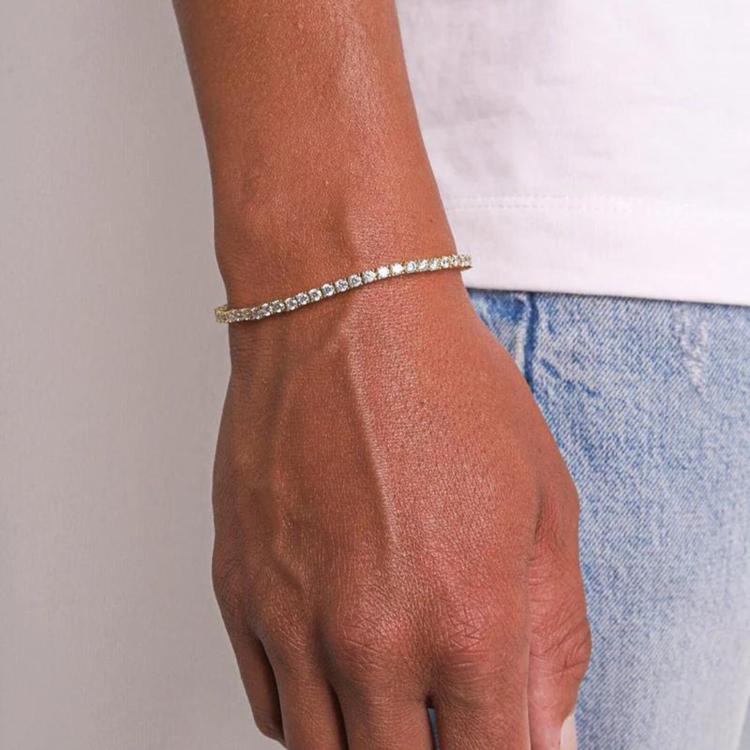 Men's model showcasing the Tennis Bracelet in 18K Gold with 3MM links, highlighting its classic design and luxurious finish for a refined and stylish accessory.