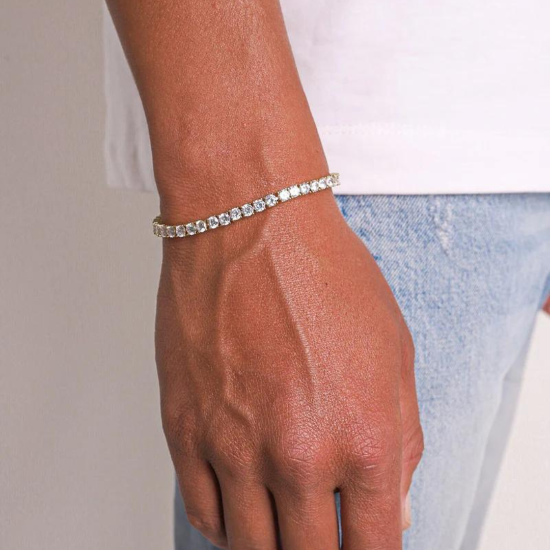 Men's model showcasing the Tennis Bracelet in 18K Gold with 4MM links, highlighting its refined design and luxurious finish for a stylish and sophisticated accessory