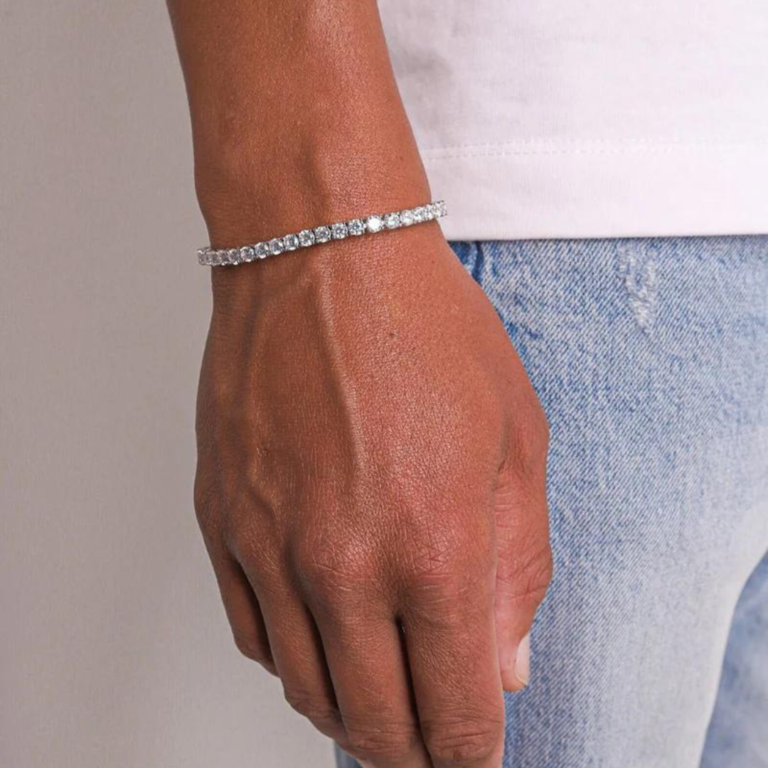 Men's model showcasing the Tennis Bracelet in White Gold with 4MM links, highlighting its refined design and luxurious finish for a high-impact and stylish accessory.