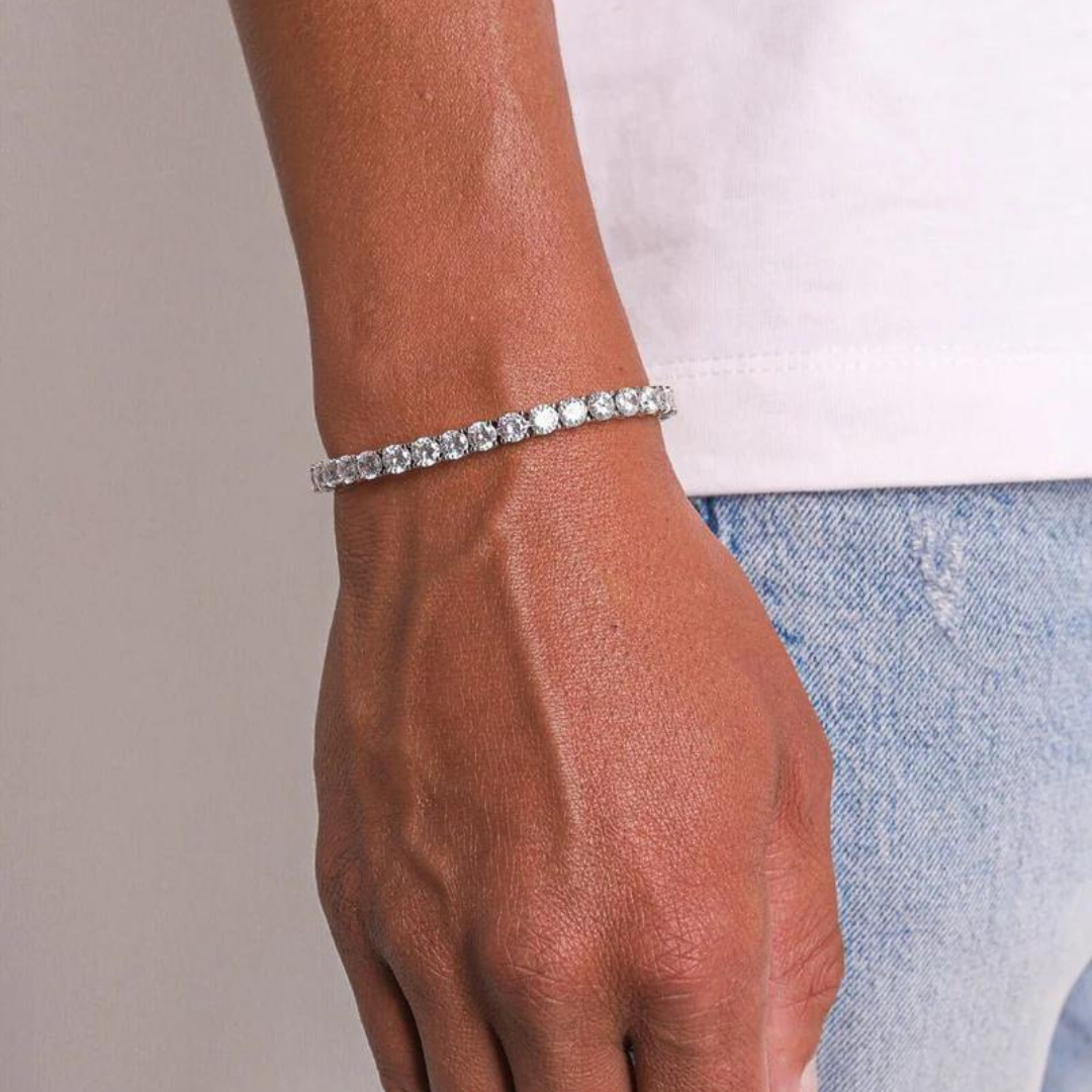 Men's model showcasing the Tennis Bracelet in White Gold with 5MM links, highlighting its bold design and opulent finish for a refined and high-impact accessory.