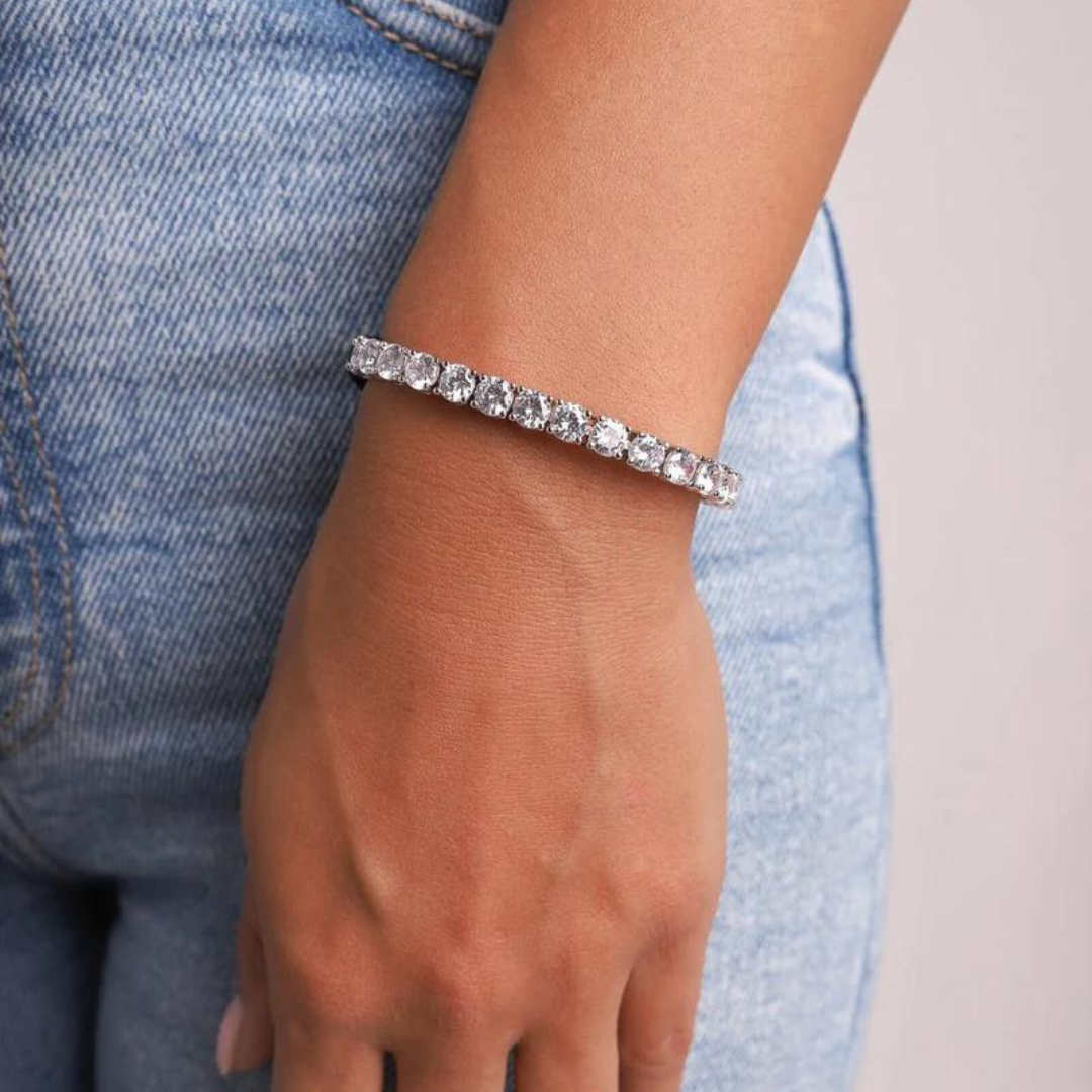 Women's model wearing the Tennis Bracelet in White Gold with 5MM links, emphasizing its elegant and bold design for a chic and sophisticated appearance.