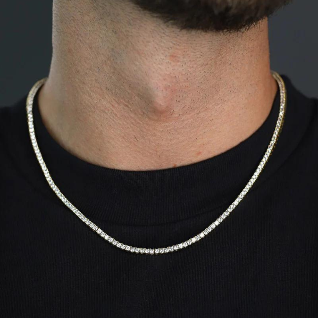 Men's model showcasing the Tennis Chain in 18K Gold with 2.5MM links, highlighting its sleek design and luxurious finish for a stylish and understated accessory.