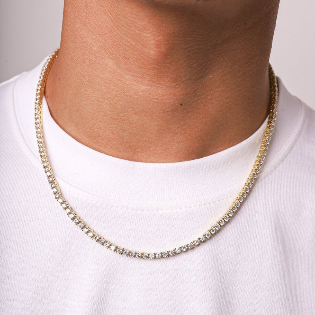 Men's model showcasing the Tennis Chain in 18K Gold with 3MM links, highlighting its sleek and elegant design for a stylish and high-impact accessory.