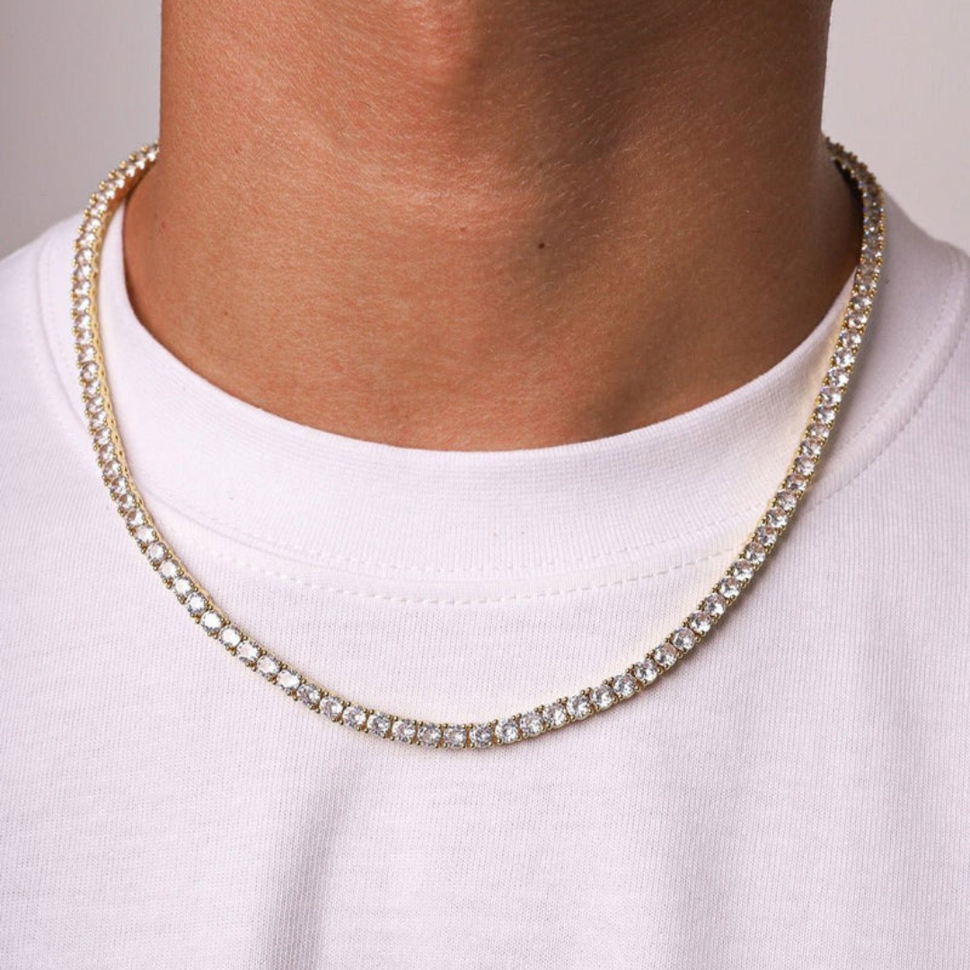 Men's model showcasing the Tennis Chain in 18K Gold with 4MM links, highlighting its bold and stylish design for a high-impact accessory that exudes luxury.