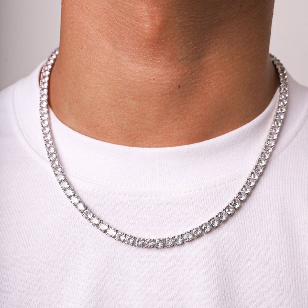 Men's model showcasing the Tennis Chain in 18K Gold with 5MM links, highlighting its bold and opulent design for a striking and stylish accessory that exudes luxury.