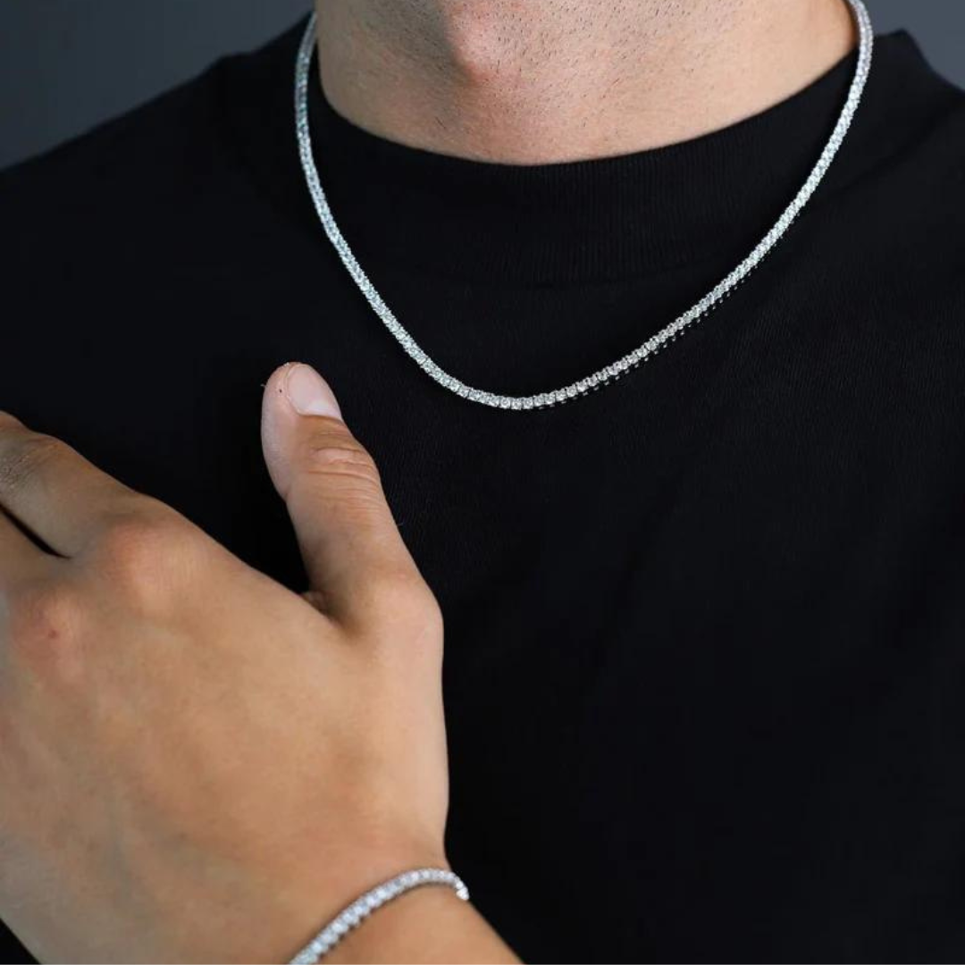 Men's model showcasing the Tennis Chain in White Gold with 2.5MM links, highlighting its sleek and elegant design for a stylish and high-quality accessory.