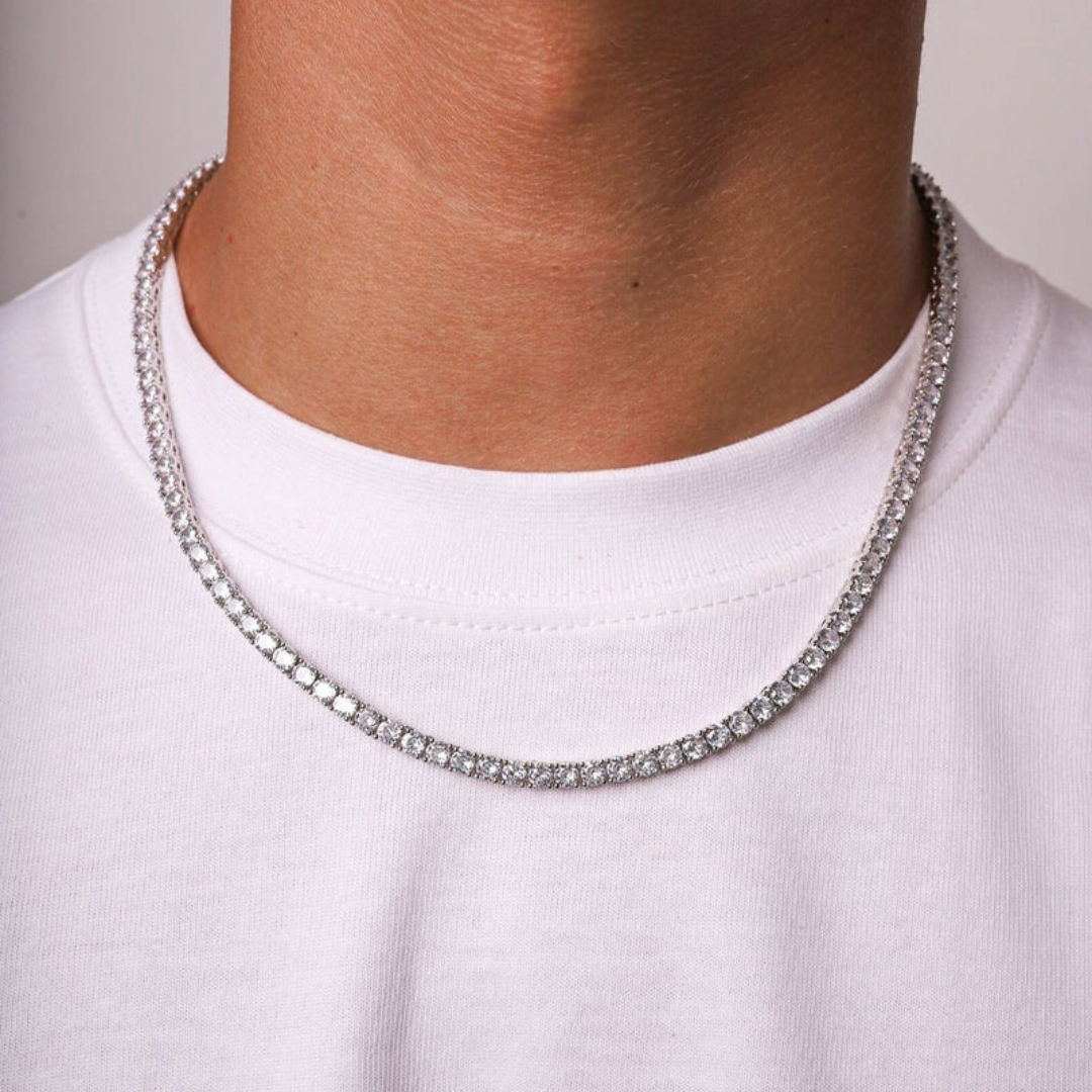 Men's model showcasing the Tennis Chain in White Gold with 4MM links, highlighting its bold and elegant design for a high-impact accessory that exudes sophistication and style.