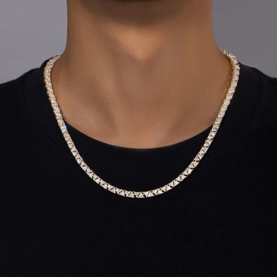 Men's model showcasing the Triangle Tennis Chain in 18K Gold with 5MM links, highlighting its bold and unique triangular design for a high-impact accessory that exudes sophistication and style.