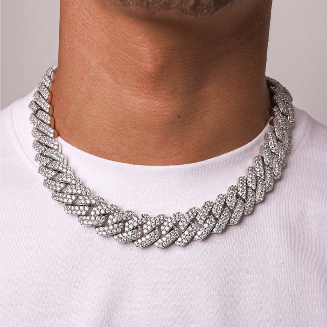 Men's model showcasing the Iced Prong Chain in White Gold with 18MM links, featuring a bold design with prong-set sparkling gemstones for a high-impact and luxurious accessory.