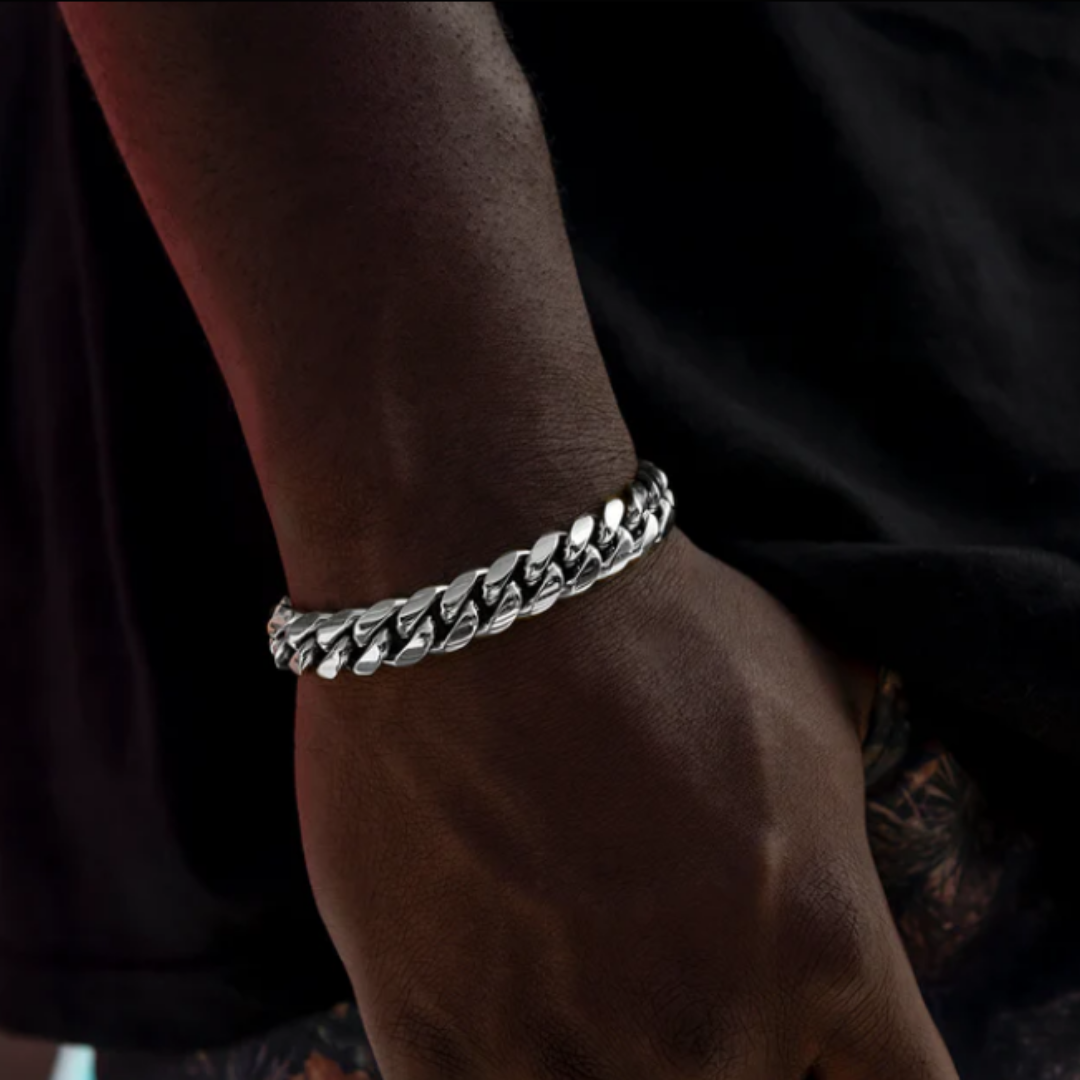 Men's model displaying the Cuban Link Bracelet in White Gold from a different angle, showcasing its bold 12MM width and elegant design for a powerful accessory.