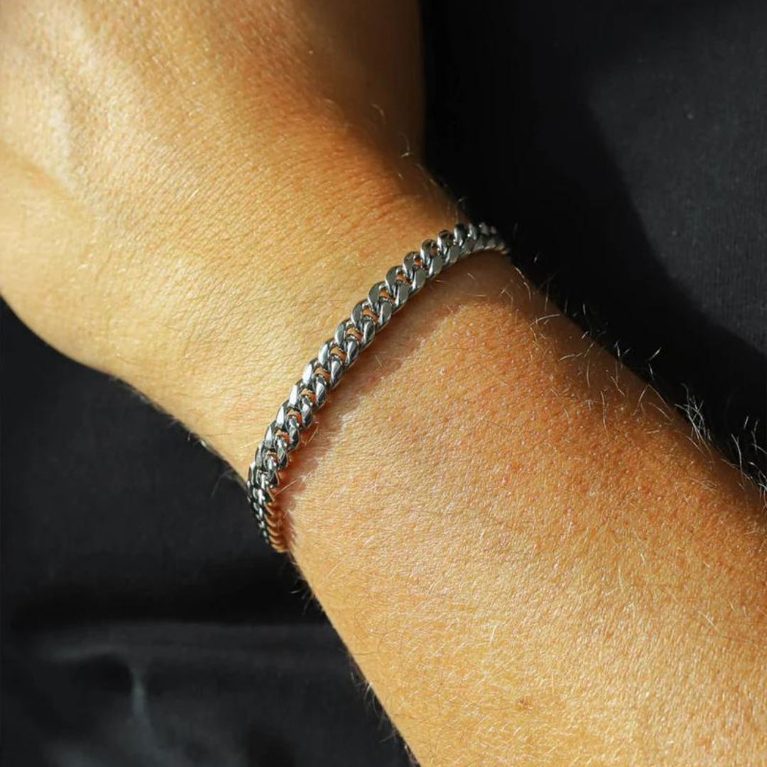 Model wearing a white gold Cuban link bracelet with a 6mm width, showcasing its sleek design and elegant shine against a contemporary and fashionable outfit